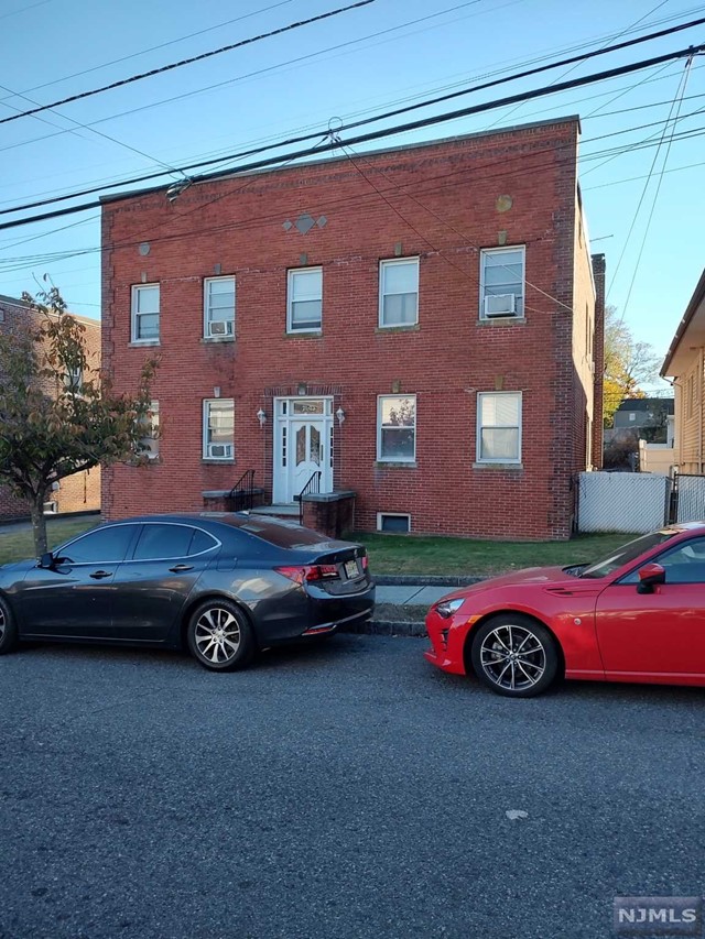 a front view of a house with parking space