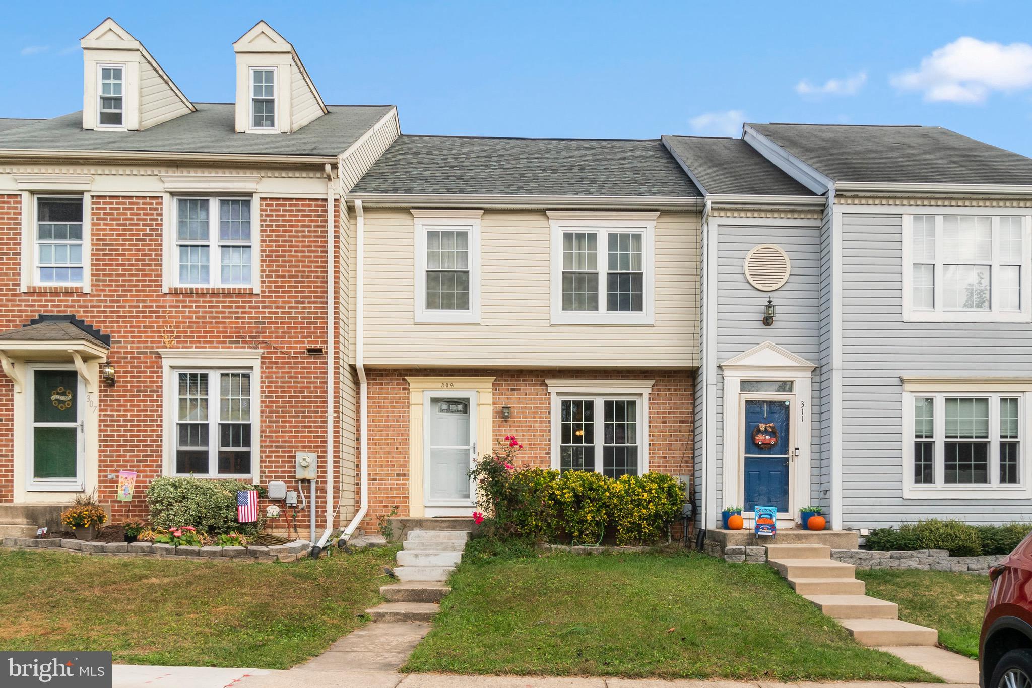 a front view of a house with a yard