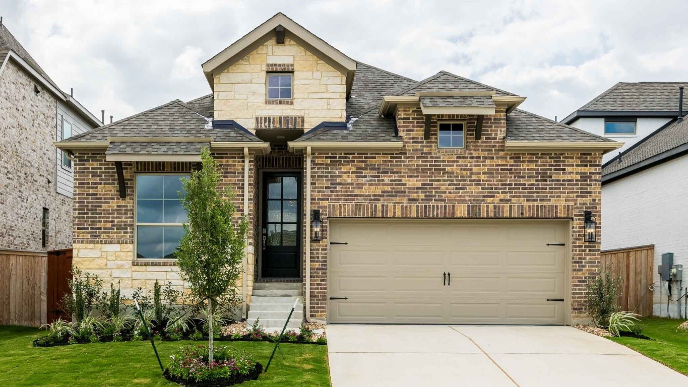 front view of a house with a yard