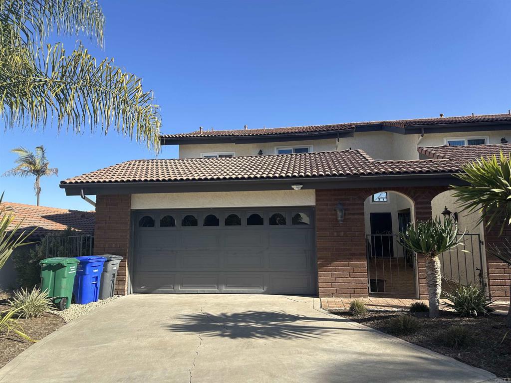 a front view of a house with a garage