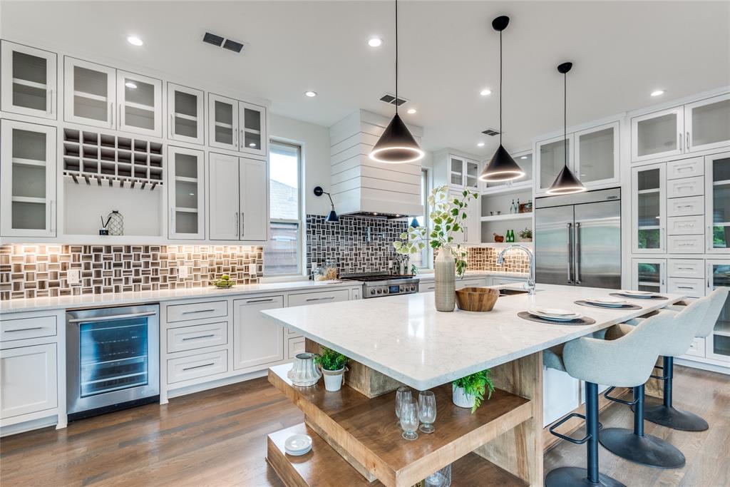 a open kitchen with dining table and chairs