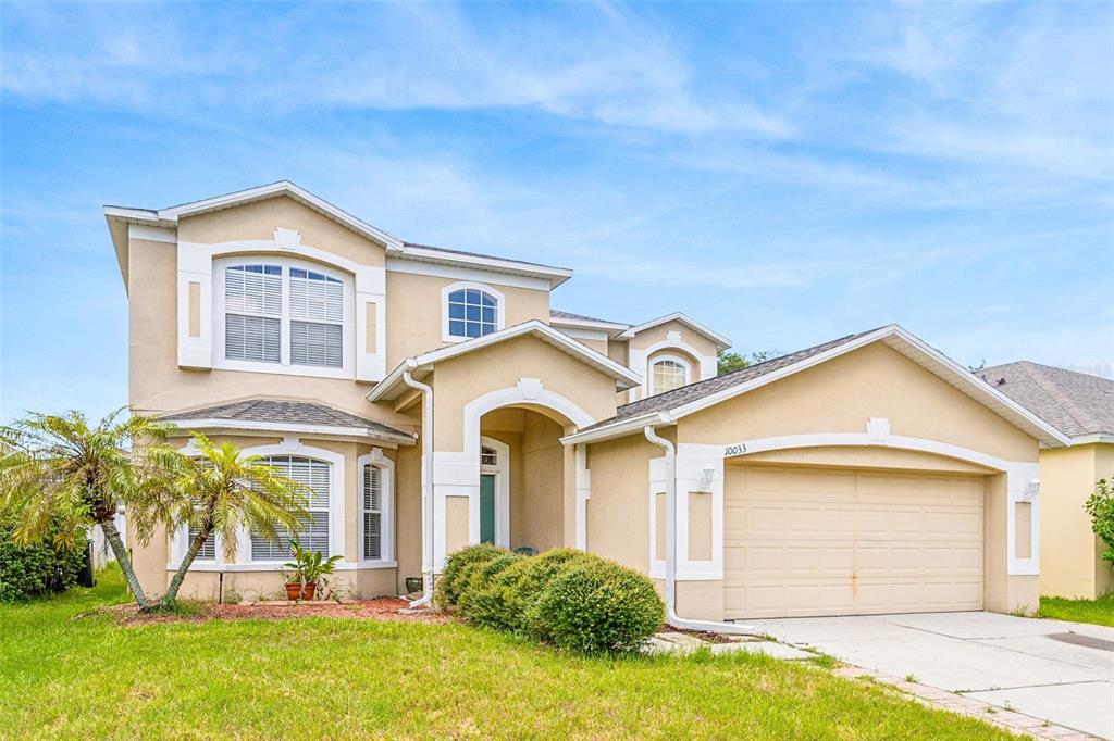 a front view of a house with a yard