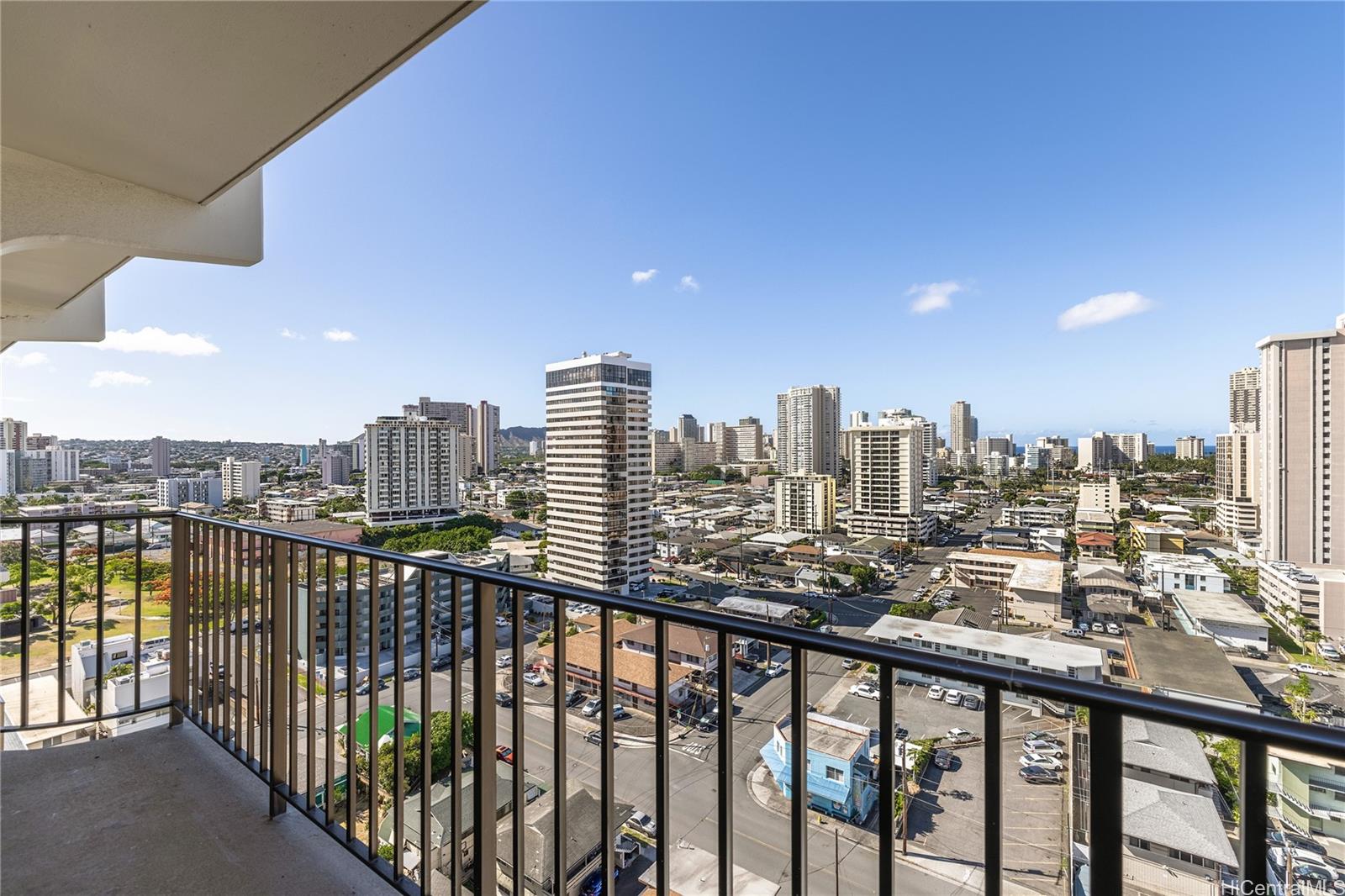 a view of a city view from a roof deck with sitting area