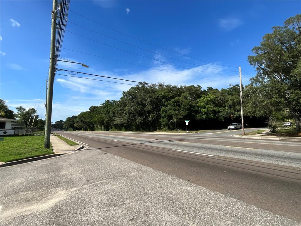 a view of a road with a yard