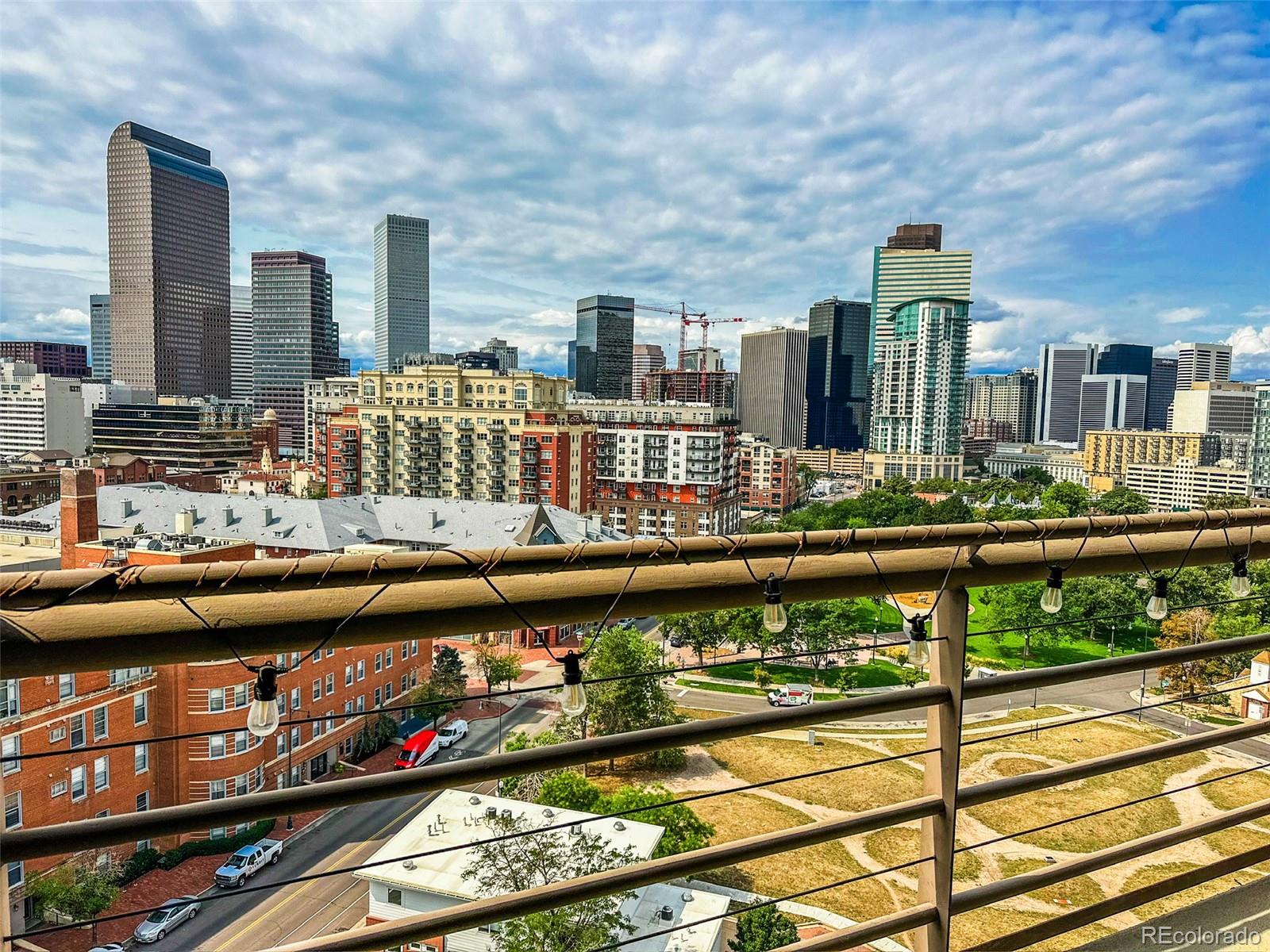 a city view from a balcony with city view