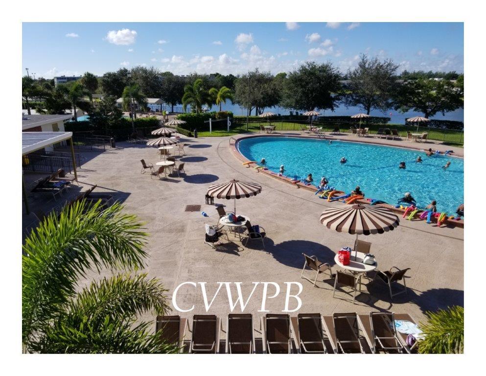 a view of swimming pool and outdoor seating