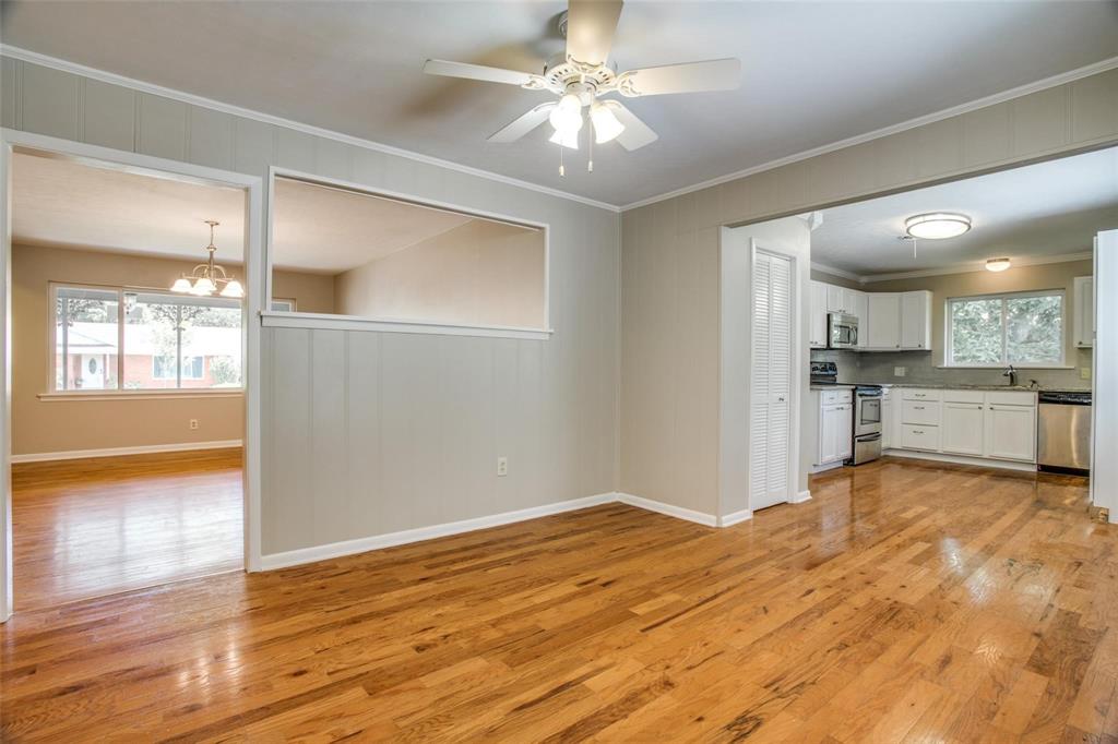 a view of a kitchen with a sink and a window