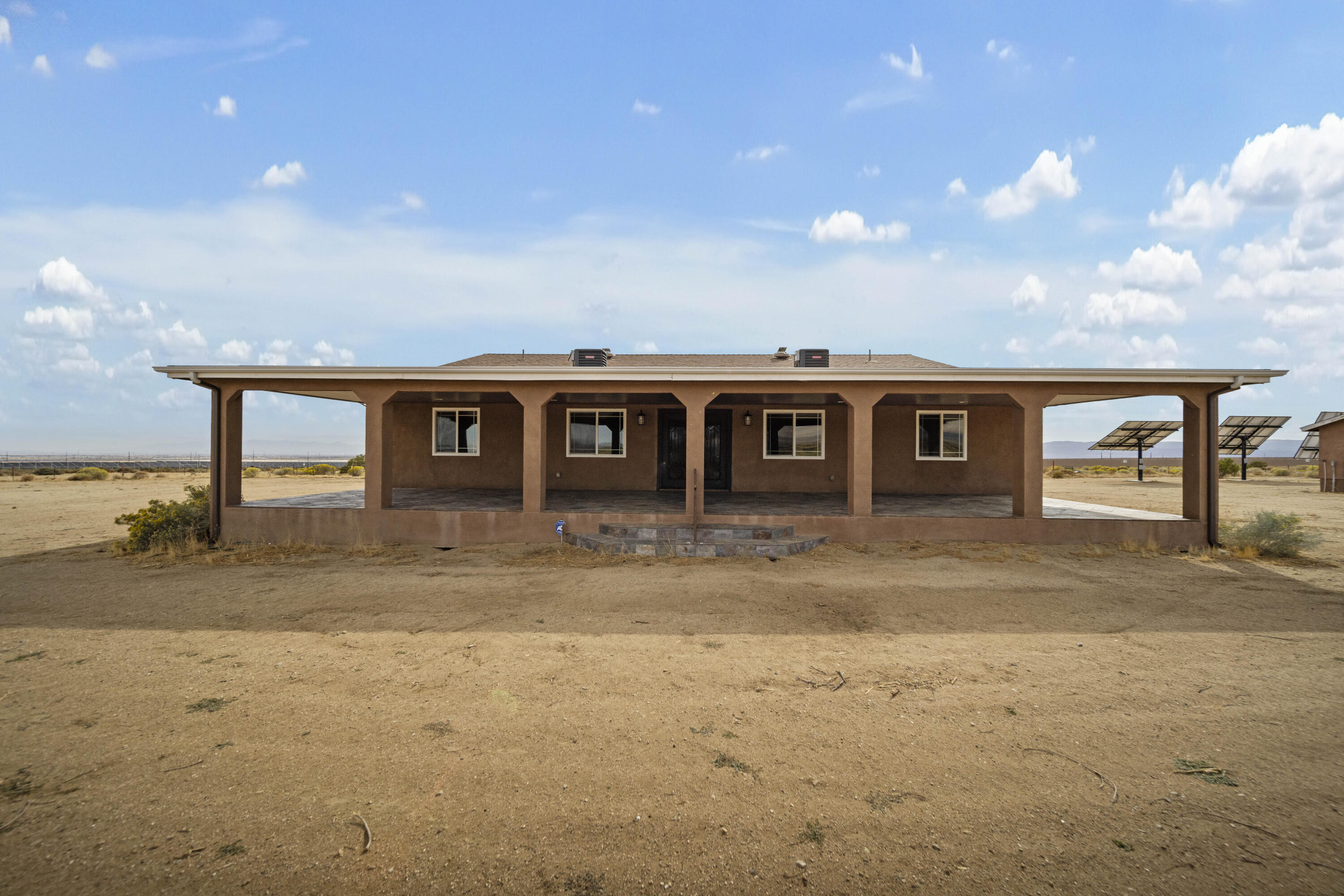 a view of a house with backyard space