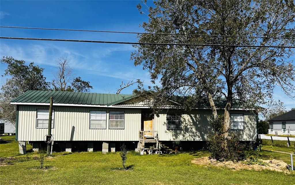 a front view of a house with a lake view