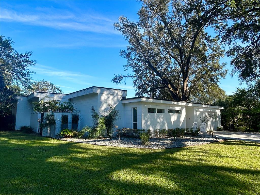 a view of a house with swimming pool yard and patio