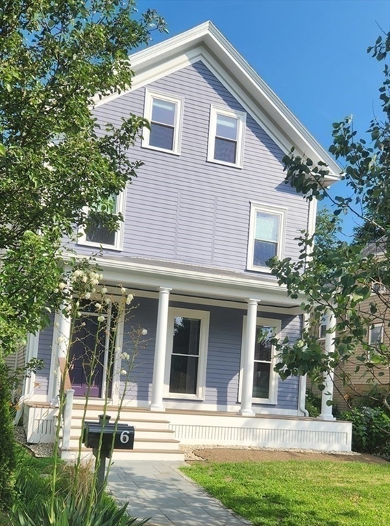 a front view of a house with a porch