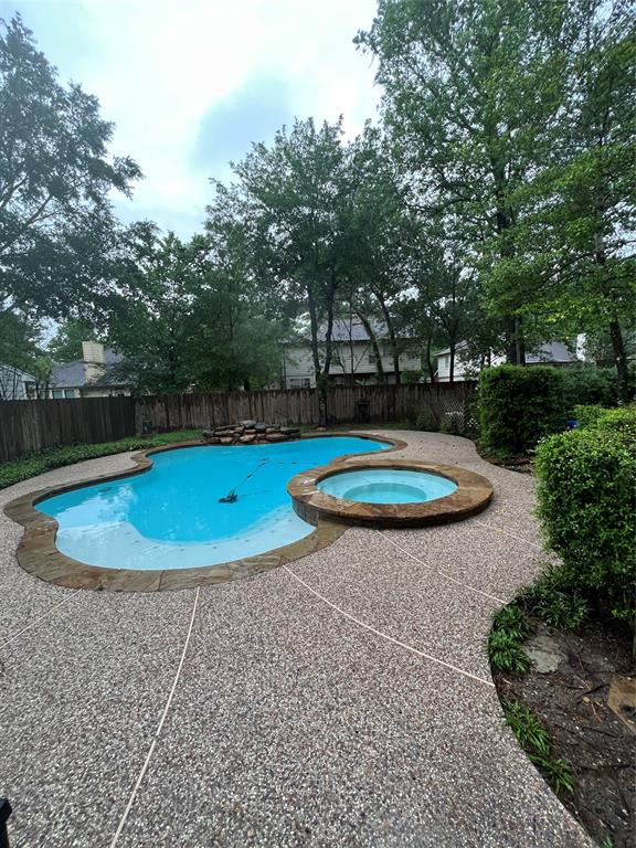 a view of a swimming pool with a patio