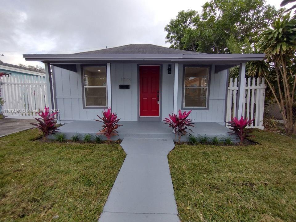 front view of a house with a yard