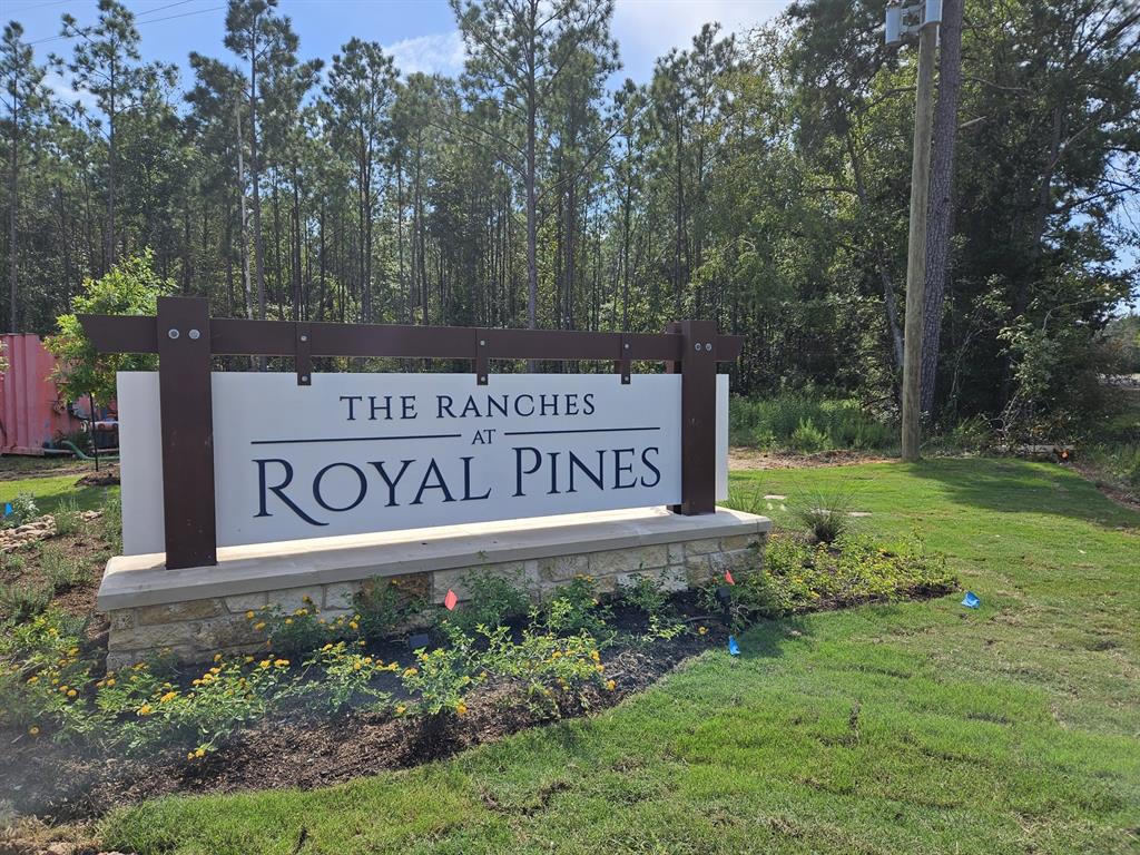 a sign broad in front of flowers