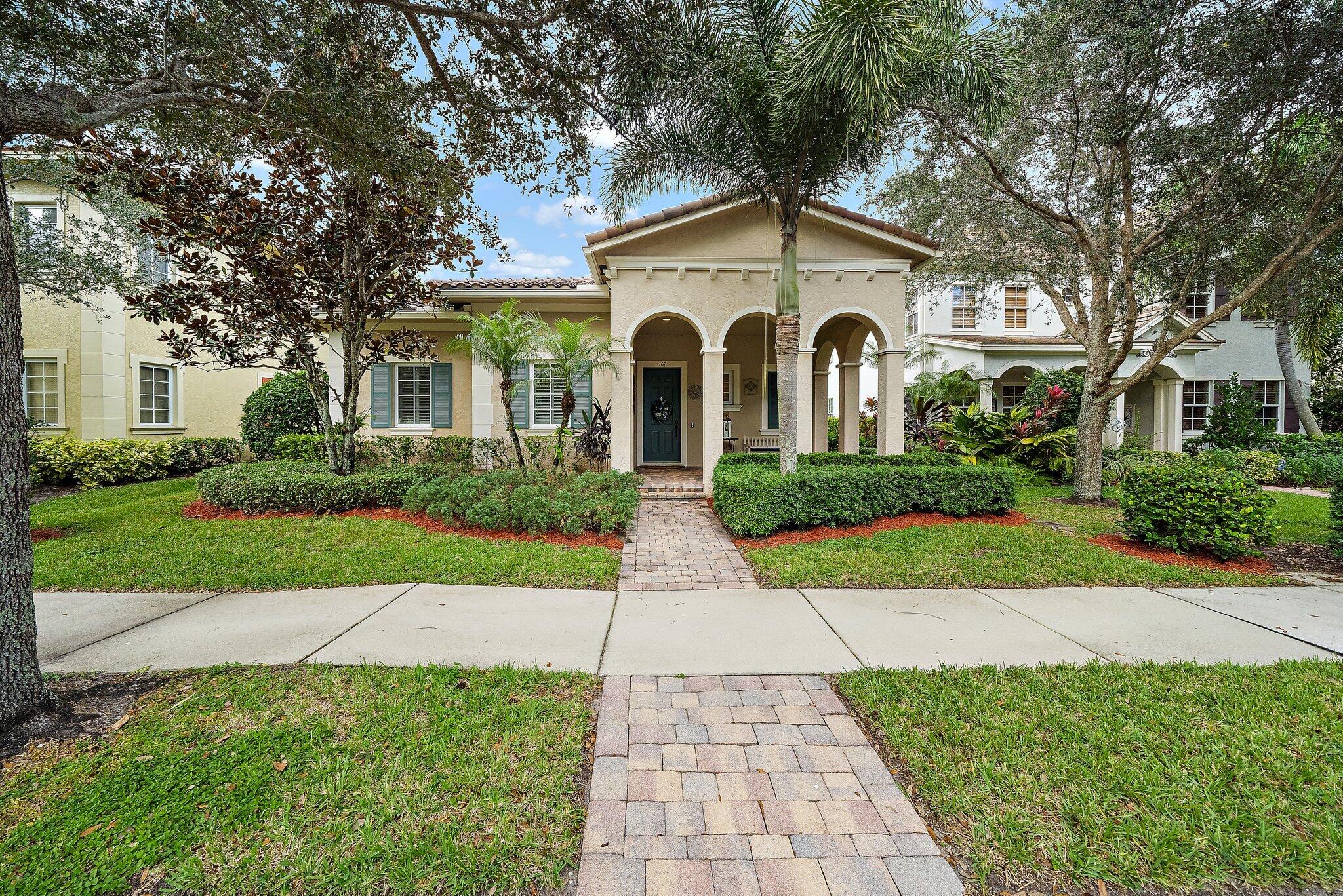 a front view of a house with yard