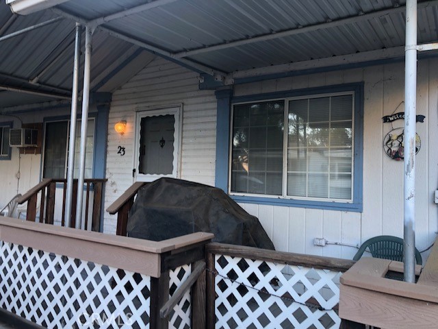 a cat sitting in front of a house