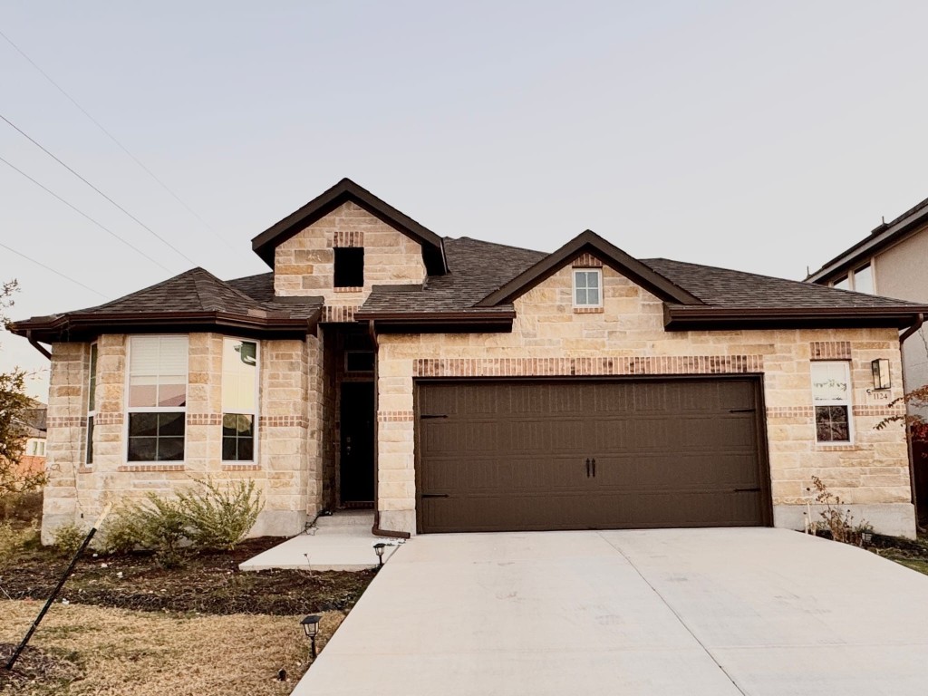 a front view of a house with yard