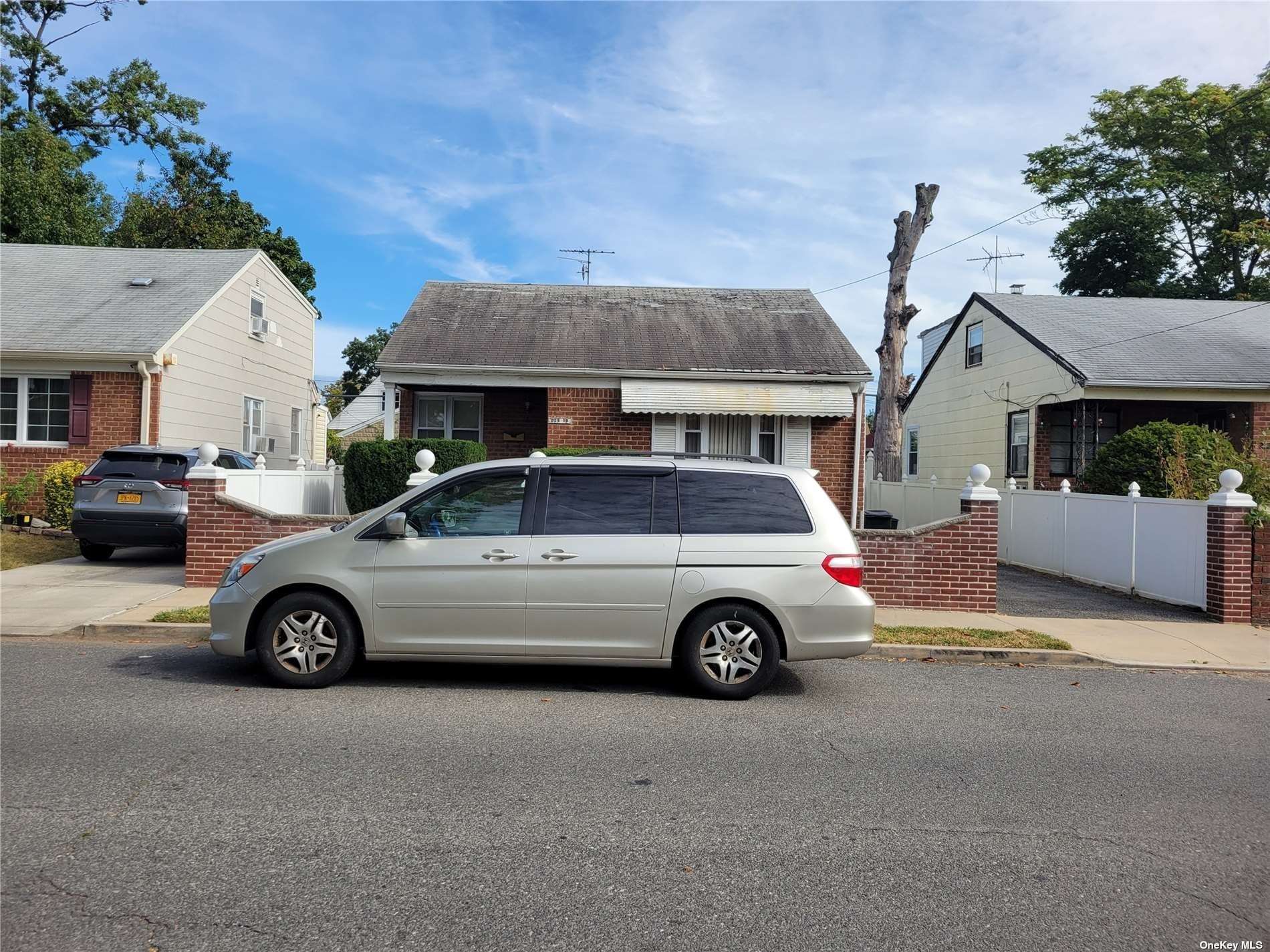 a car parked in front of a house