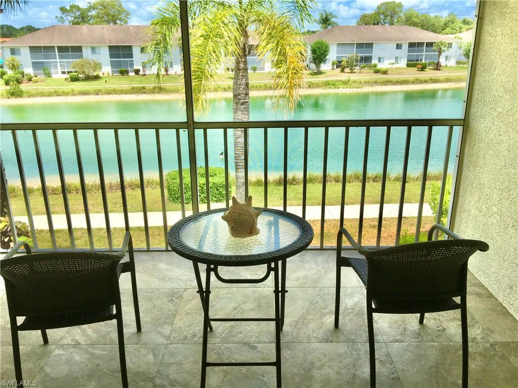 a view of a chairs and table in patio