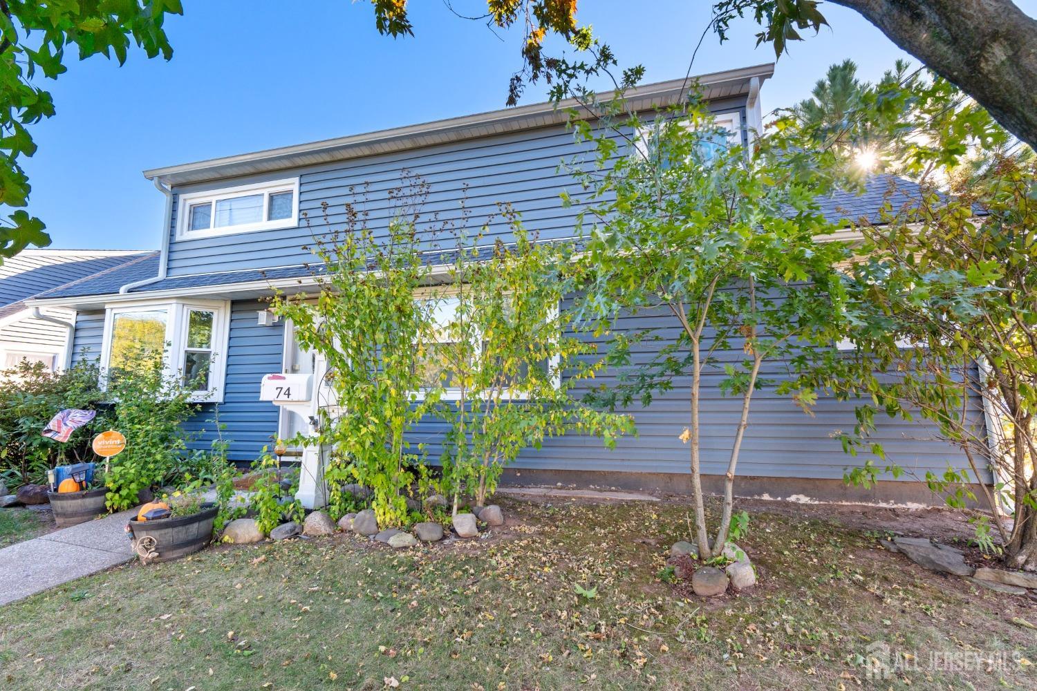 a front view of a house with a yard