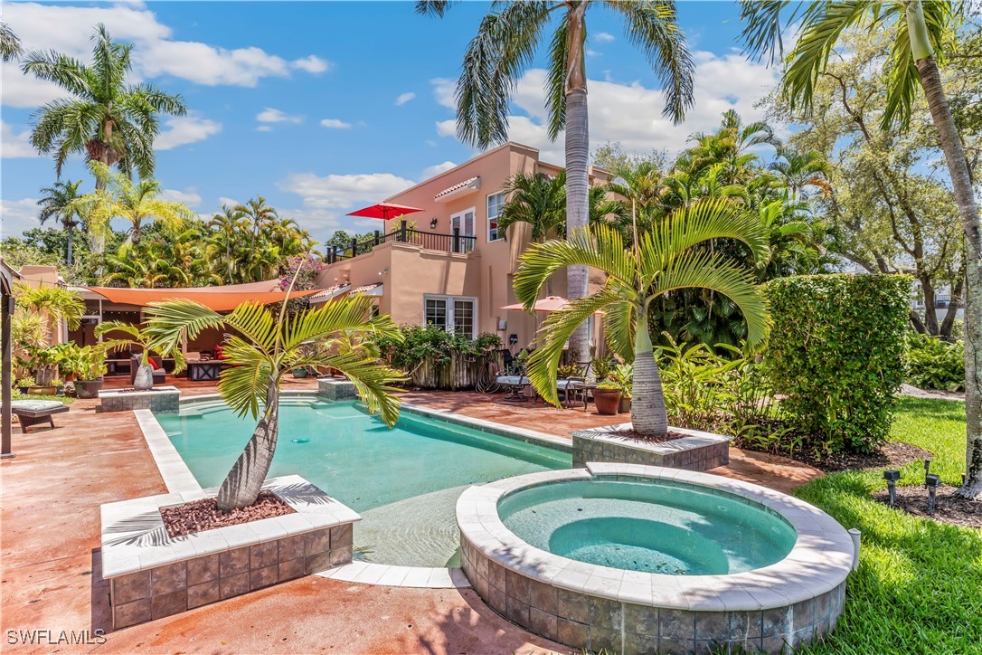 a swimming pool with outdoor seating and trees