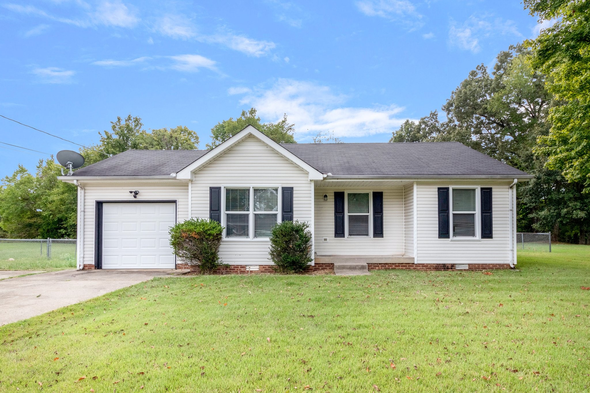 front view of a house with a yard