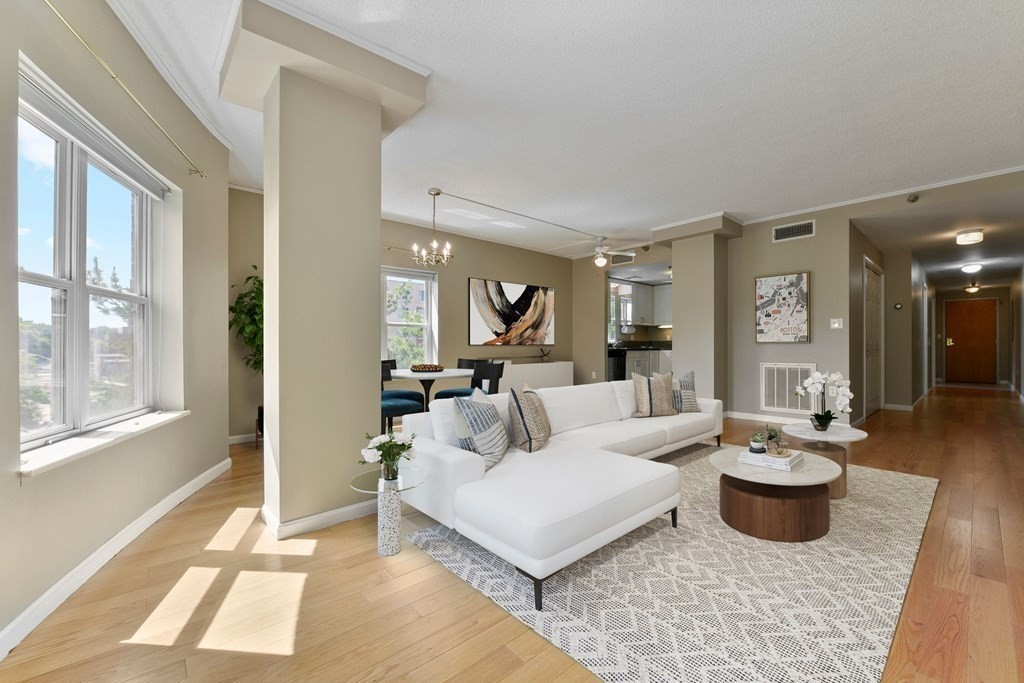 a living room with furniture and a large window