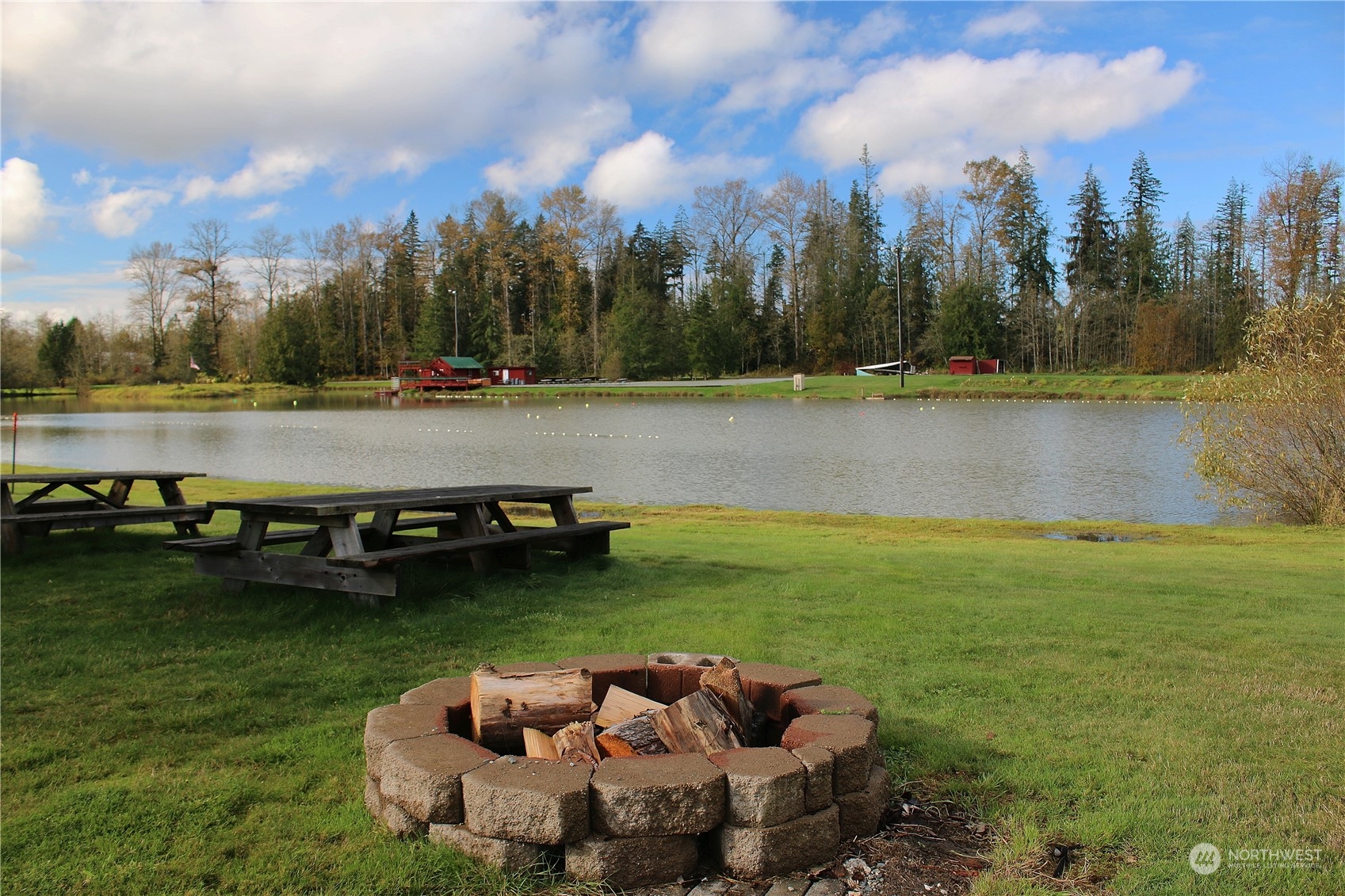 a view of a lake with houses in the back