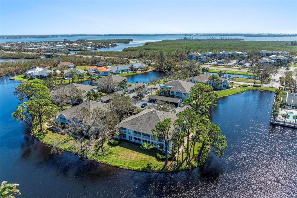 an aerial view of a house with a lake view