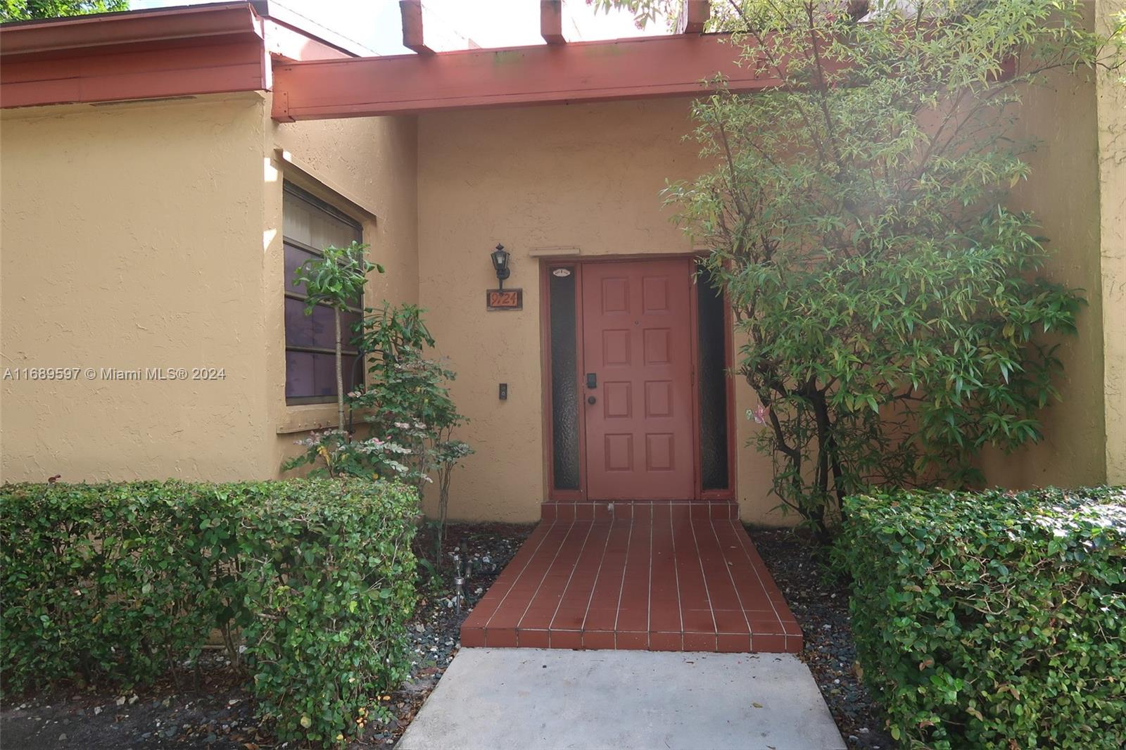 view of a pathway both side of house