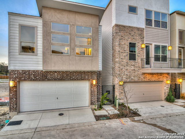 a front view of a house with a garage