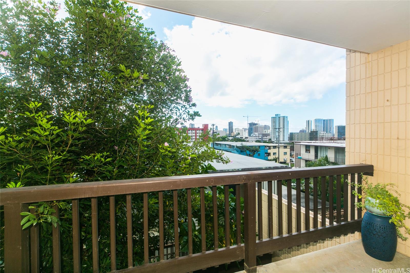 a view of a balcony with city view