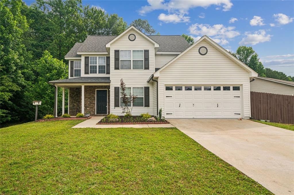 a front view of a house with a yard