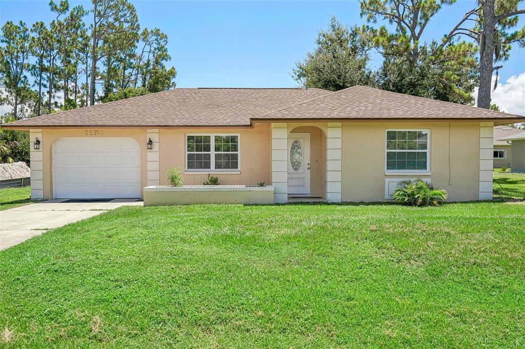 front view of a house with a yard