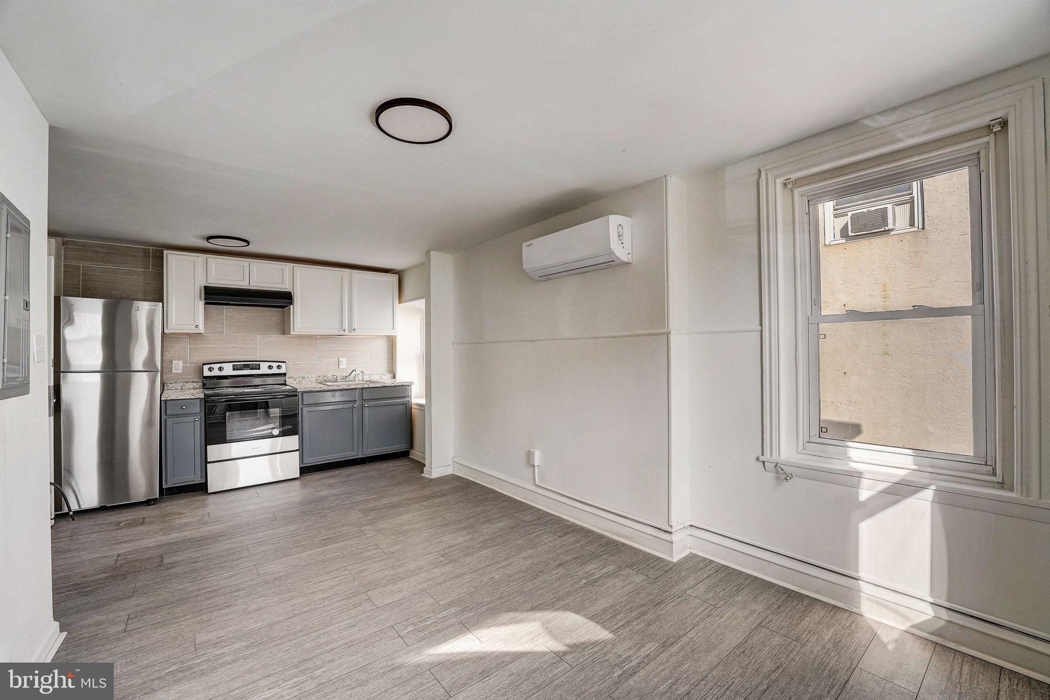 a kitchen with stainless steel appliances a refrigerator and a stove