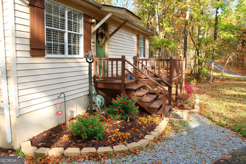 a view of a house with a yard and sitting area