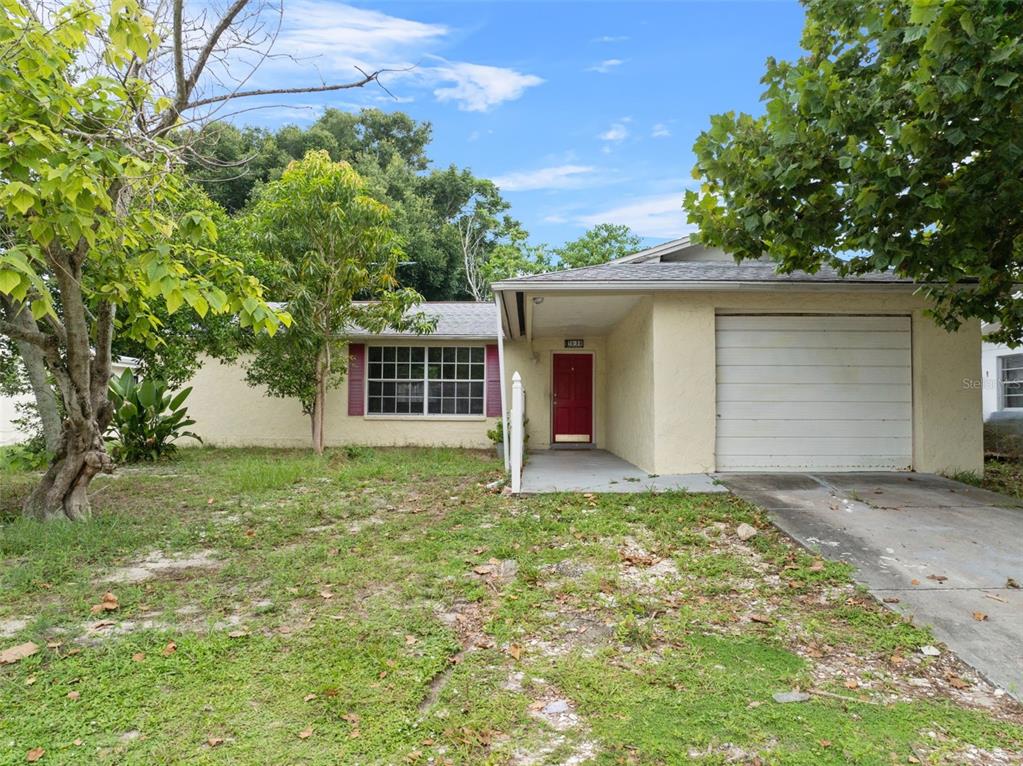 front view of a house with a yard