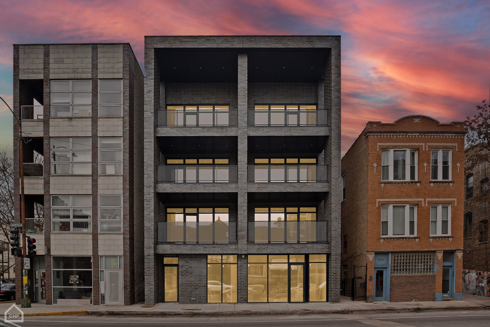 a view of a brick building next to a yard