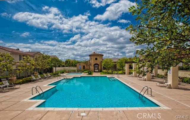 a view of a swimming pool with a patio