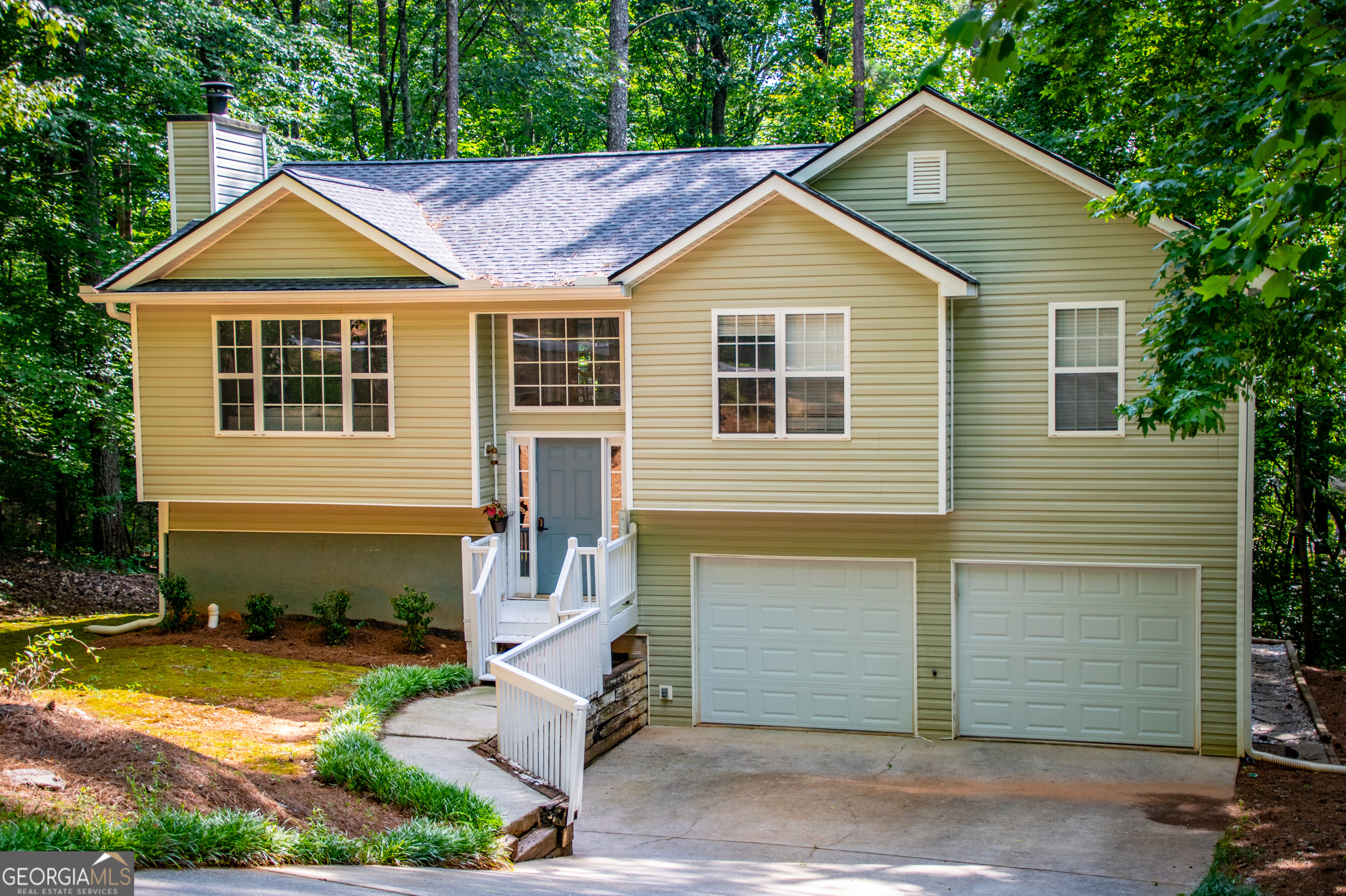 a front view of a house with a yard