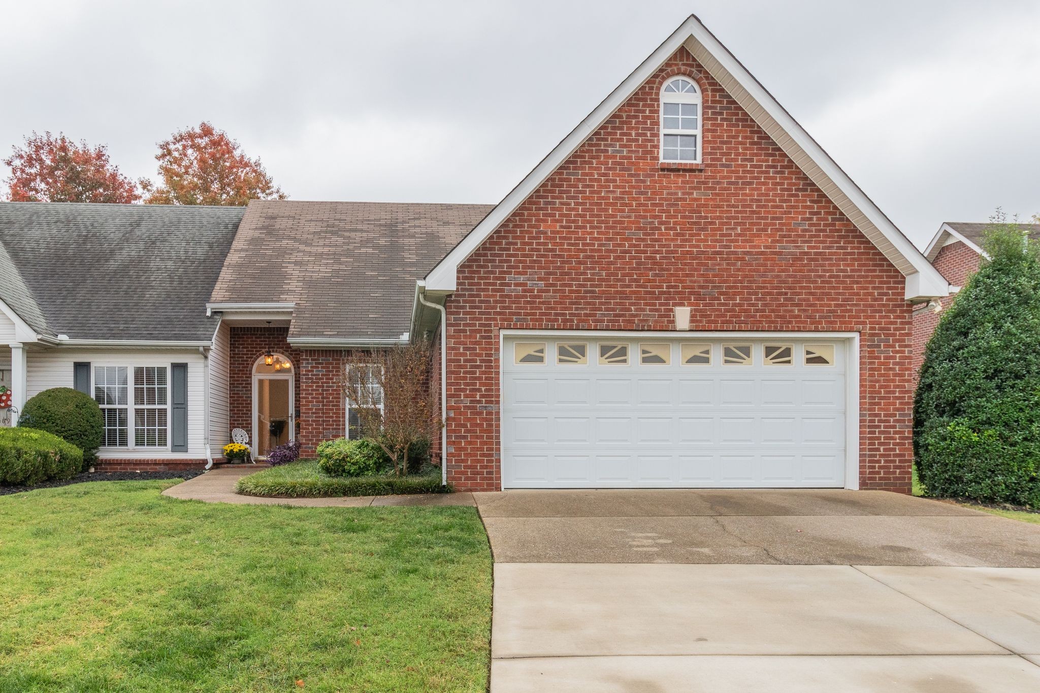 a front view of house a yard and garage