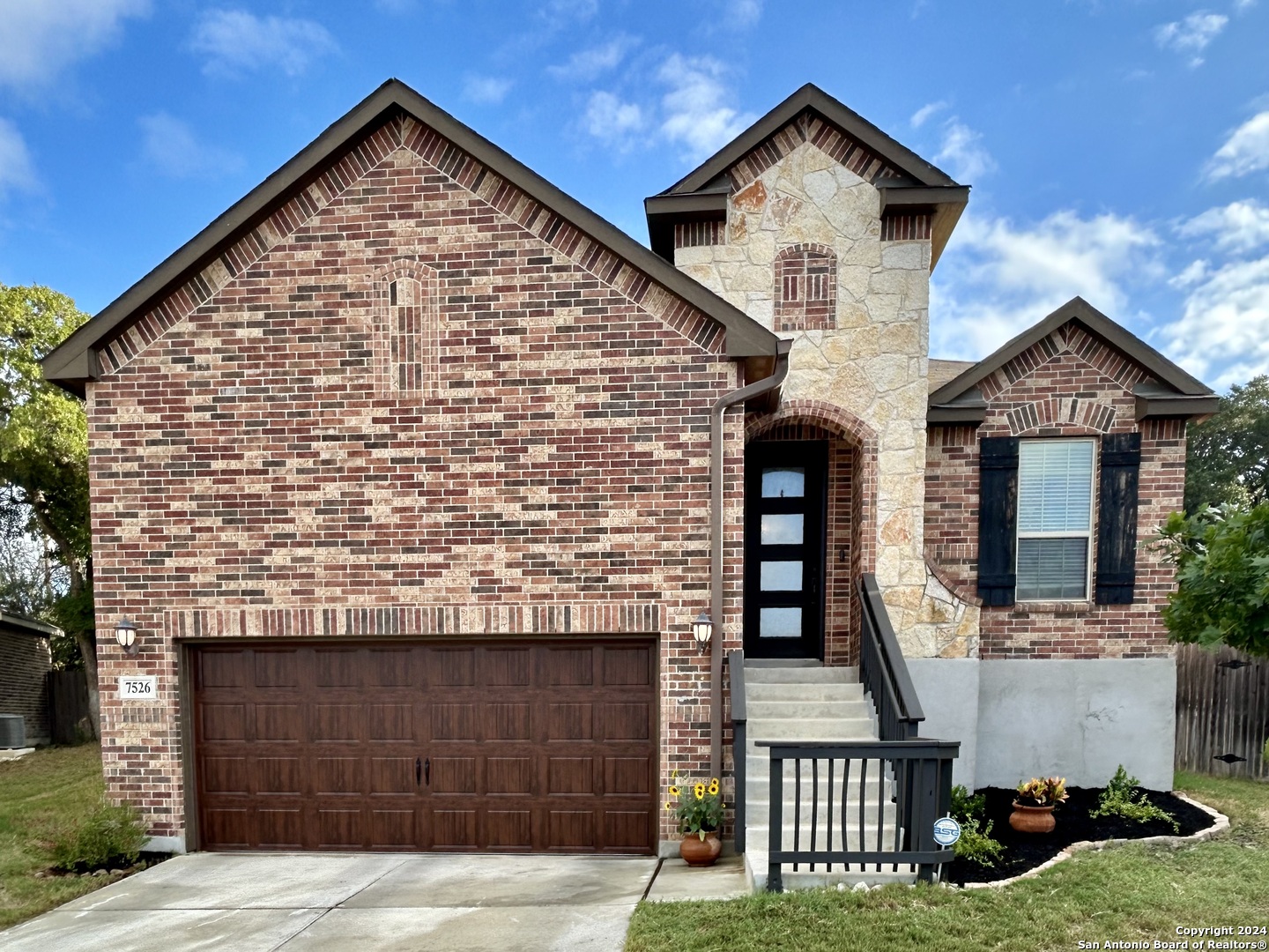 front view of a house with a yard