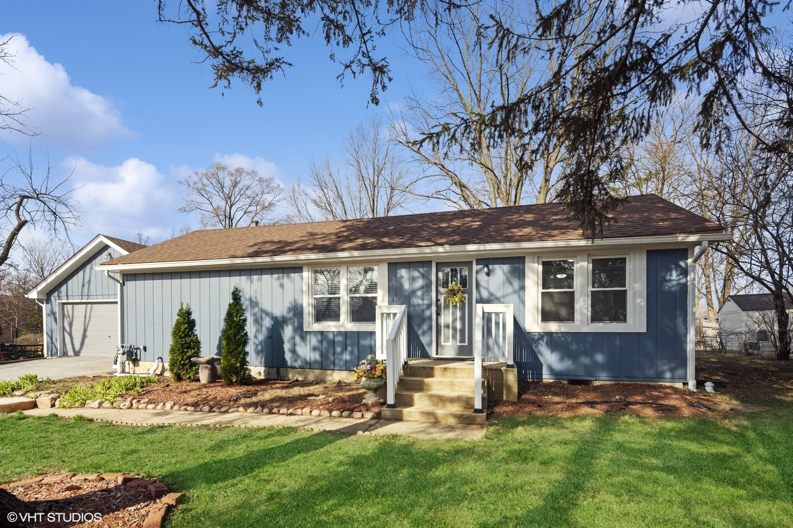 front view of a house with a yard