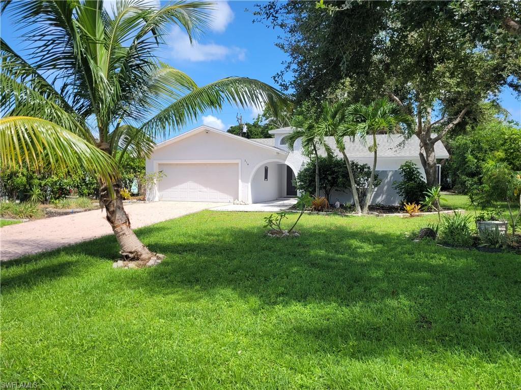 a view of a house with a small yard