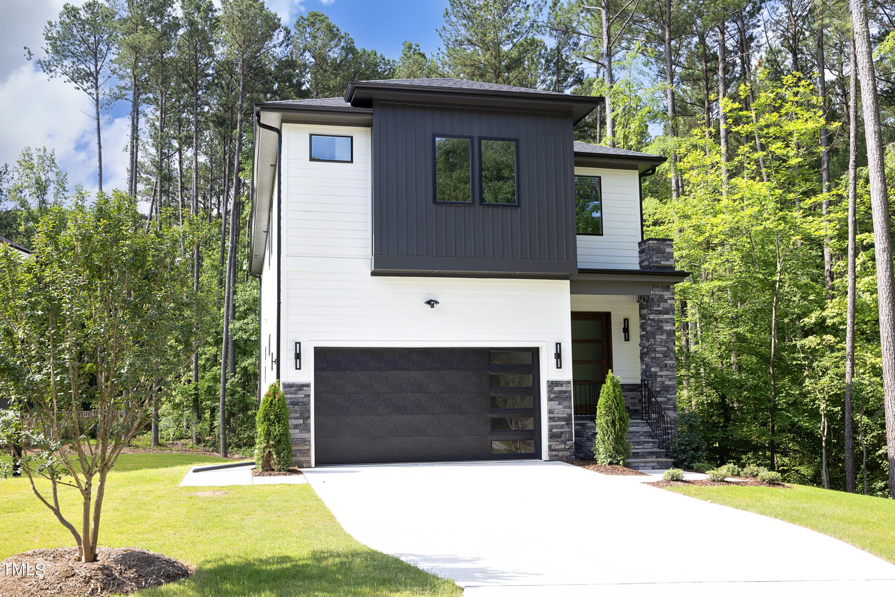 a front view of a house with yard