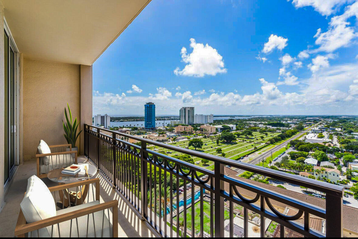 a view of a balcony with an outdoor seating