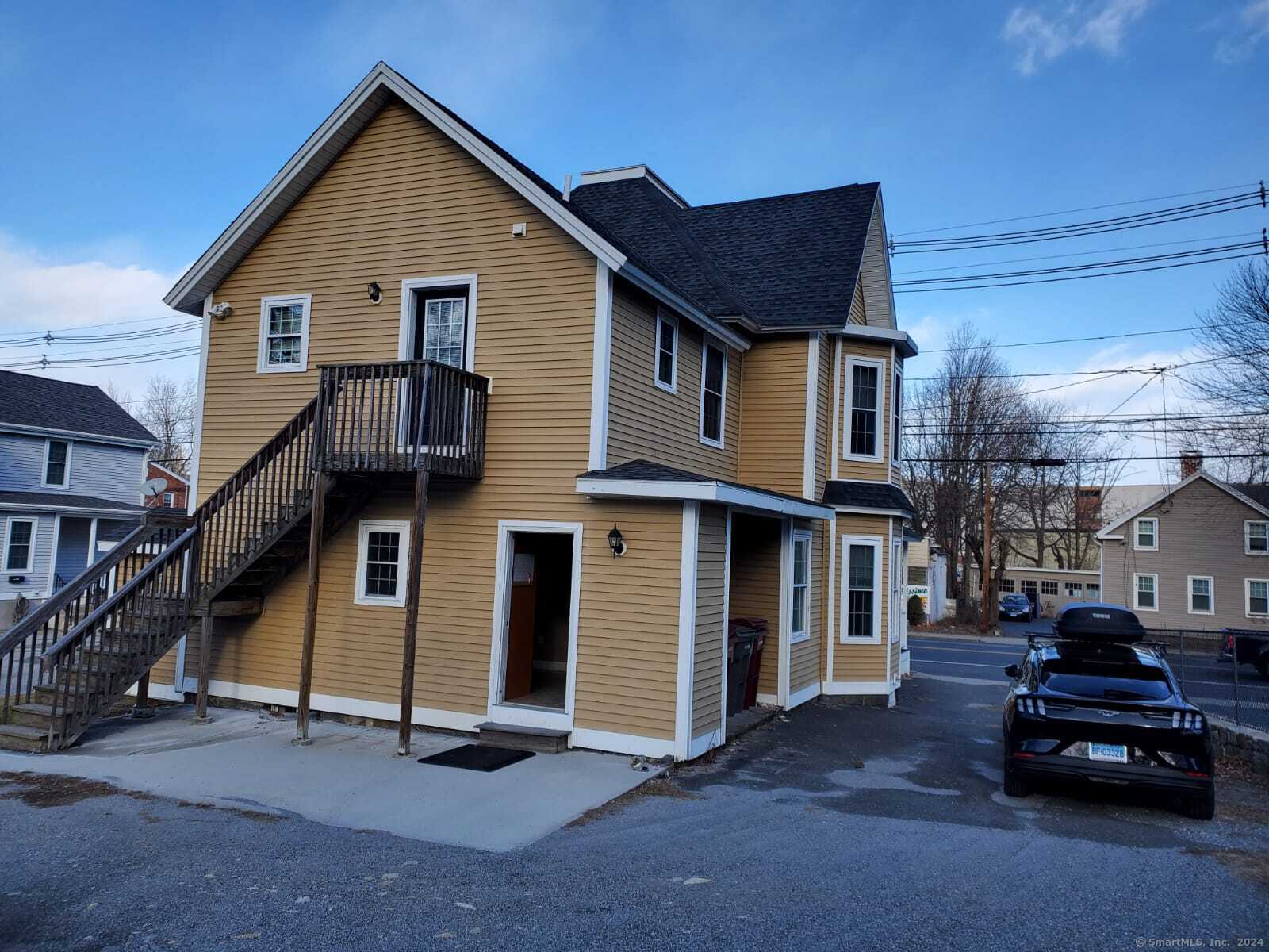 a car parked in front of a house