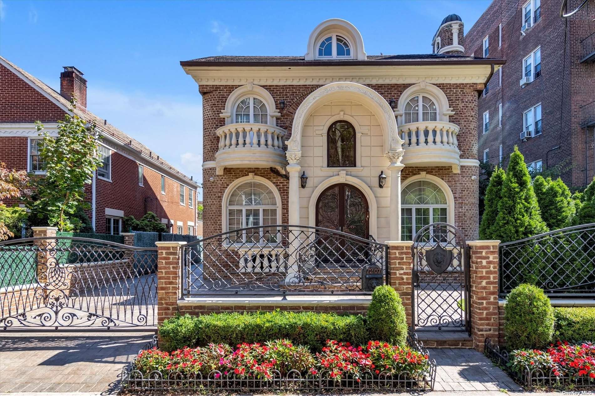 a front view of a house with a garden