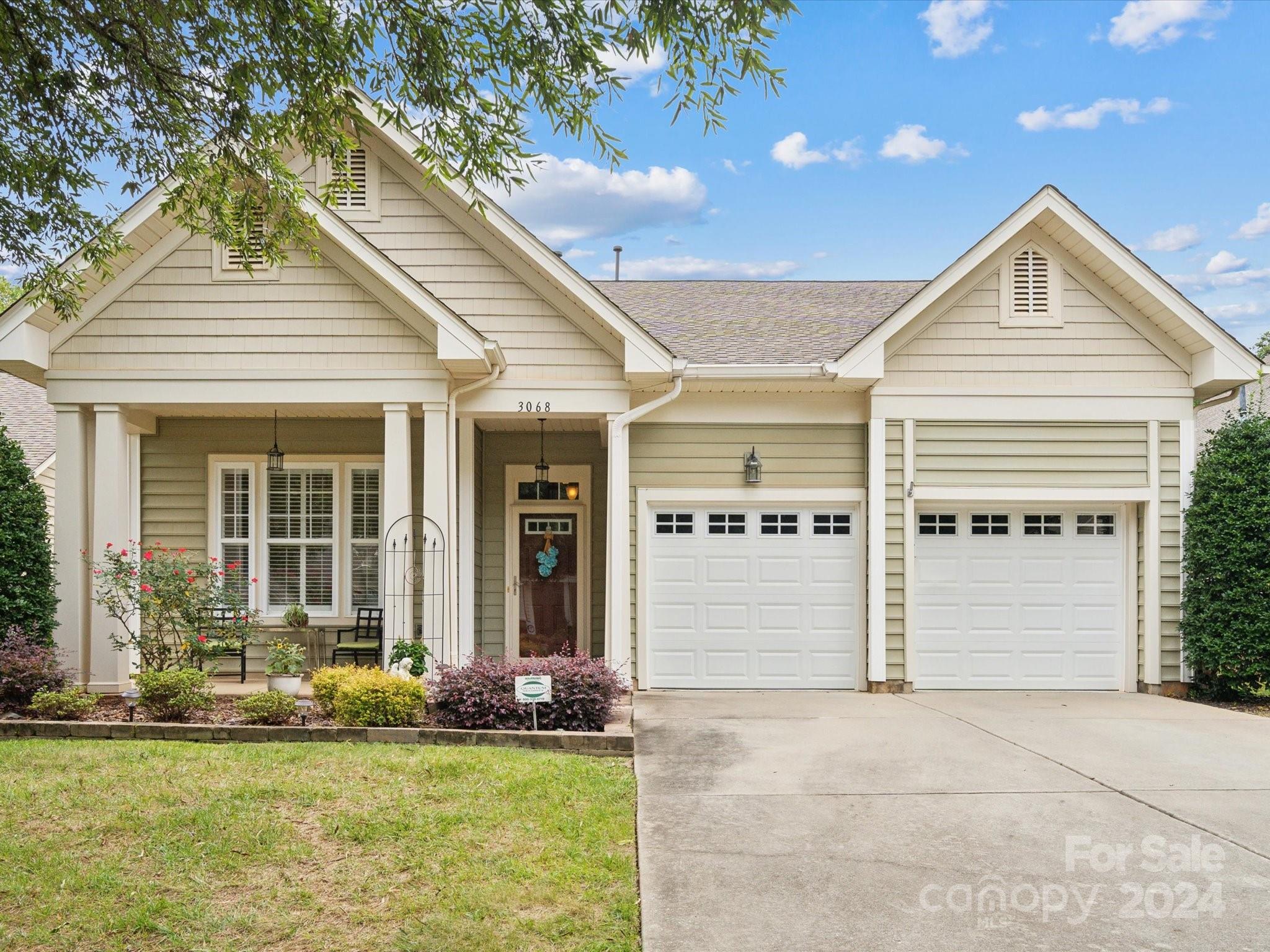 front view of a house with a yard