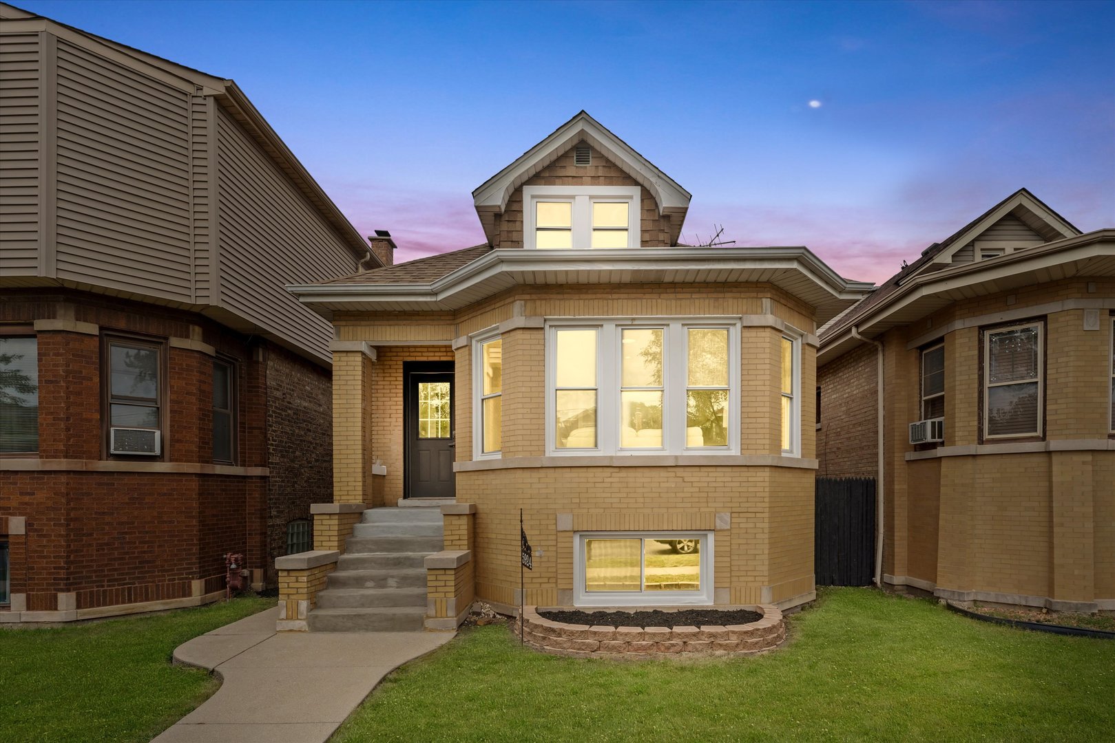 a front view of a house with a yard